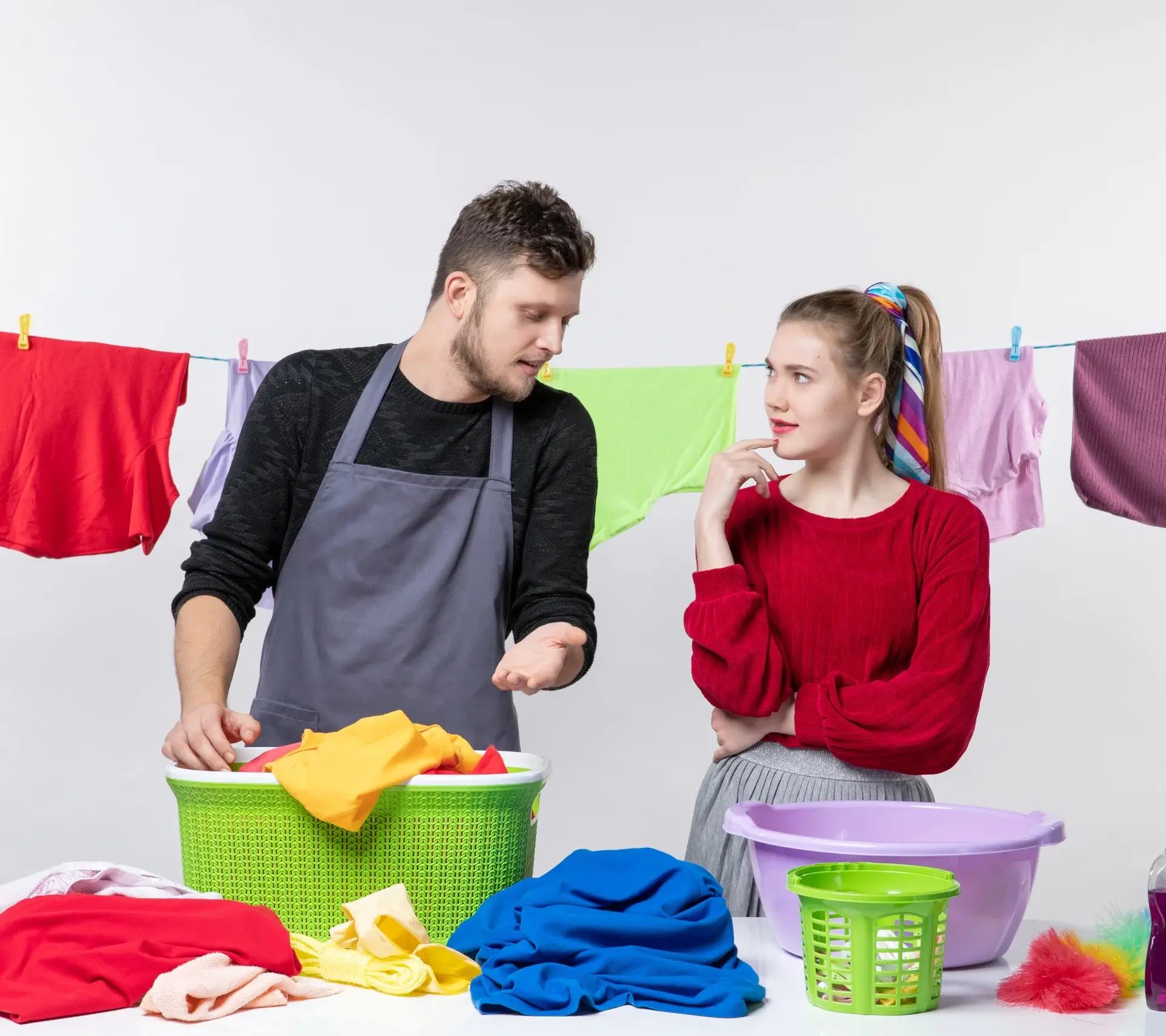 front-view-housekeeping-day-man-wife-standing-table-laundry-baskets-washing-stuffs-table-clothes-rope-scaled-ezgif.com-resize